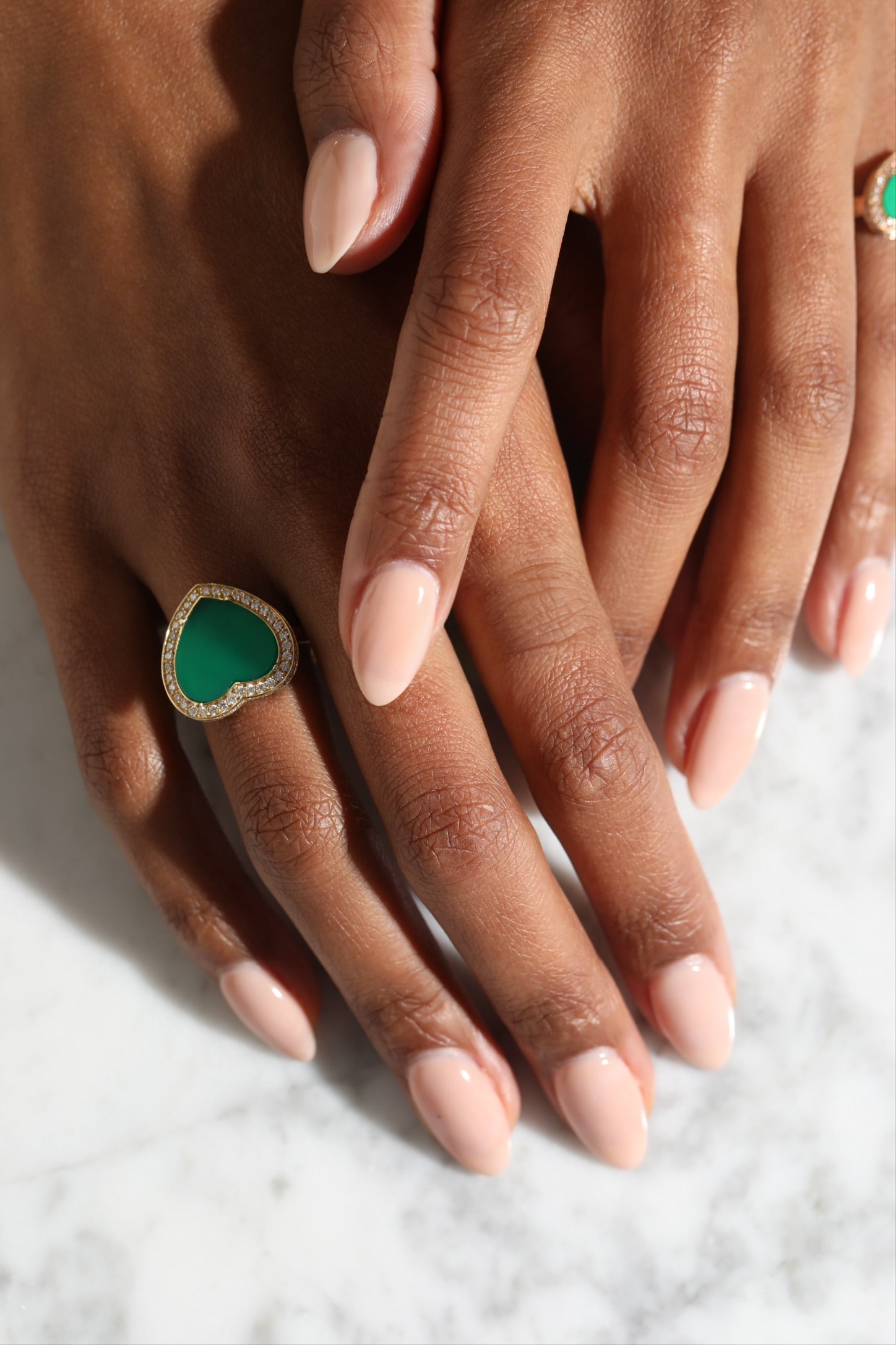 Amore ring with green agate worn on hand