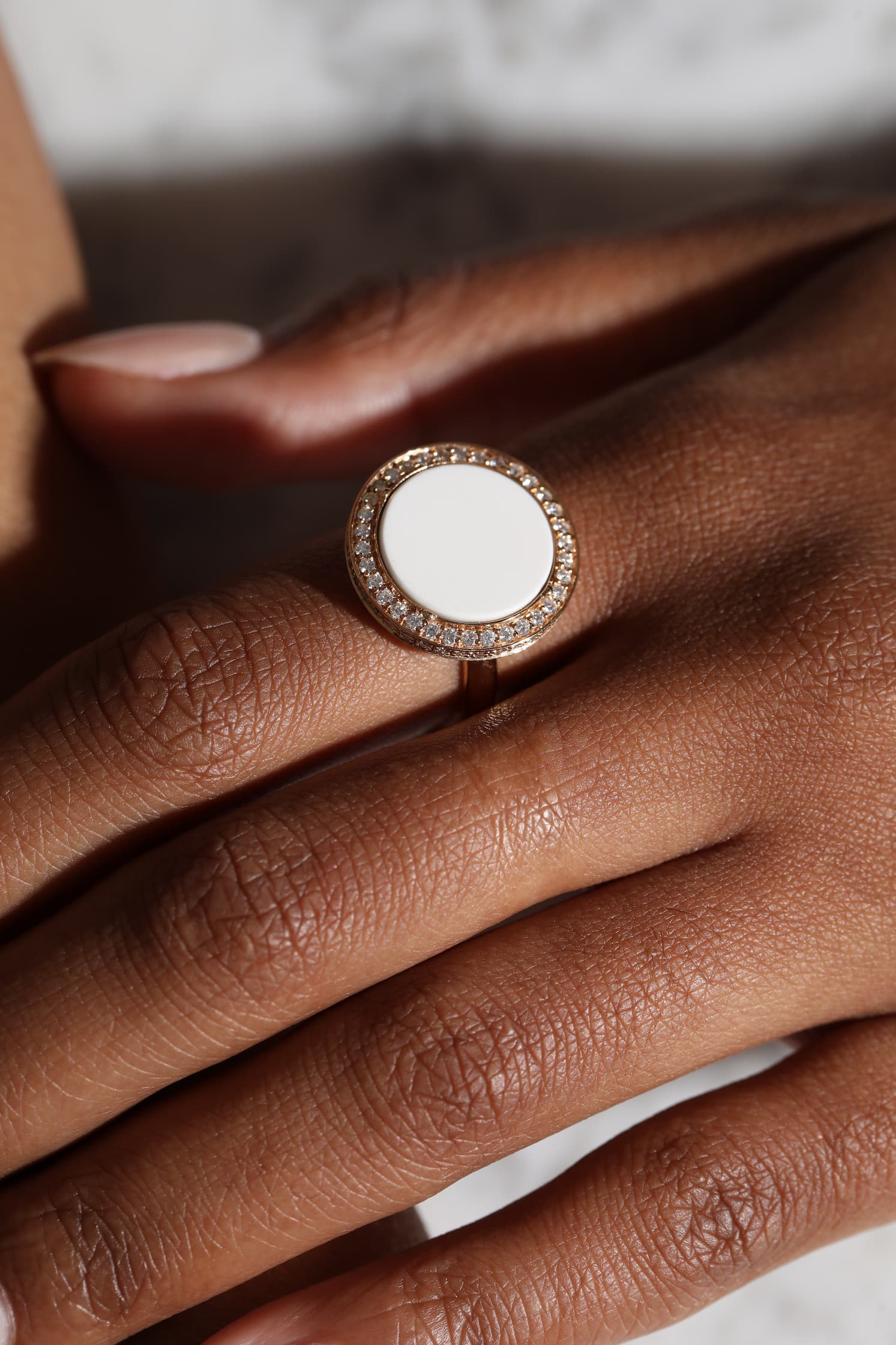 Eternity ring with white agate worn on hand