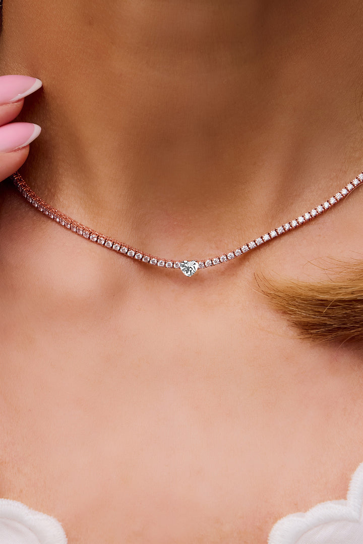 Model wearing the tennis necklace with diamonds in rose gold
